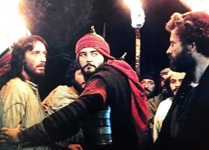 Scene depicting the betrayal of Jesus with Judas and soldiers carrying torches